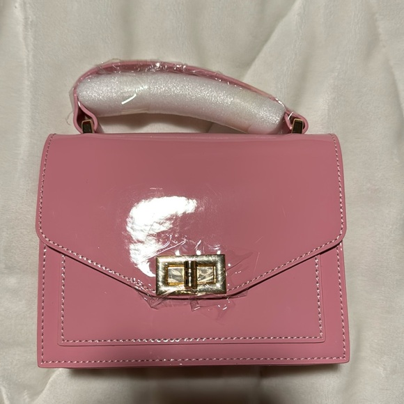 Handbags - Brand new never used Pink small body purse gold hardware glossy look